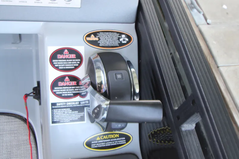 Slide: The Image of Control panel of 2020 Harris FloteBote Solstice 250 SL with safety warnings and throttle lever. - 24