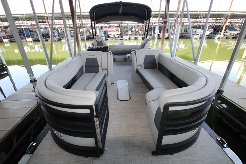 Slide: The Image of 2020 Harris FloteBote Solstice 250 SL pontoon boat with luxurious seating at a marina. - 25