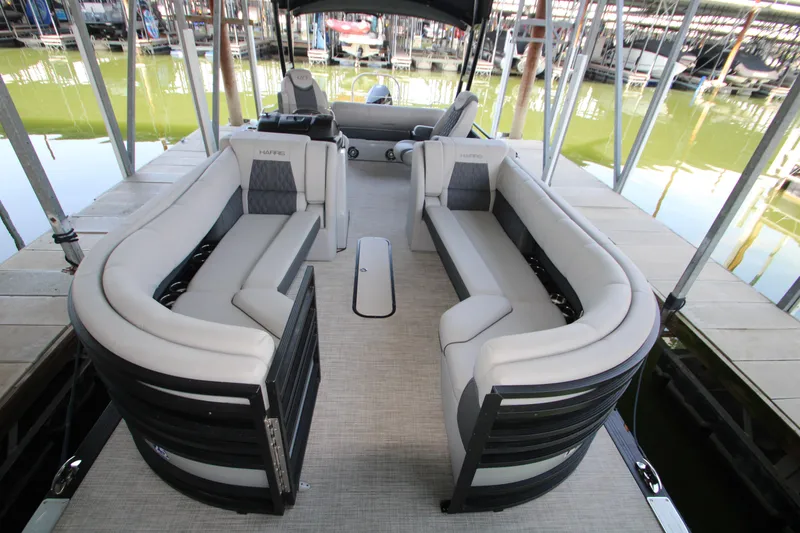 Slide: The Image of 2020 Harris FloteBote Solstice 250 SL pontoon boat with luxurious seating at a dock. - 26