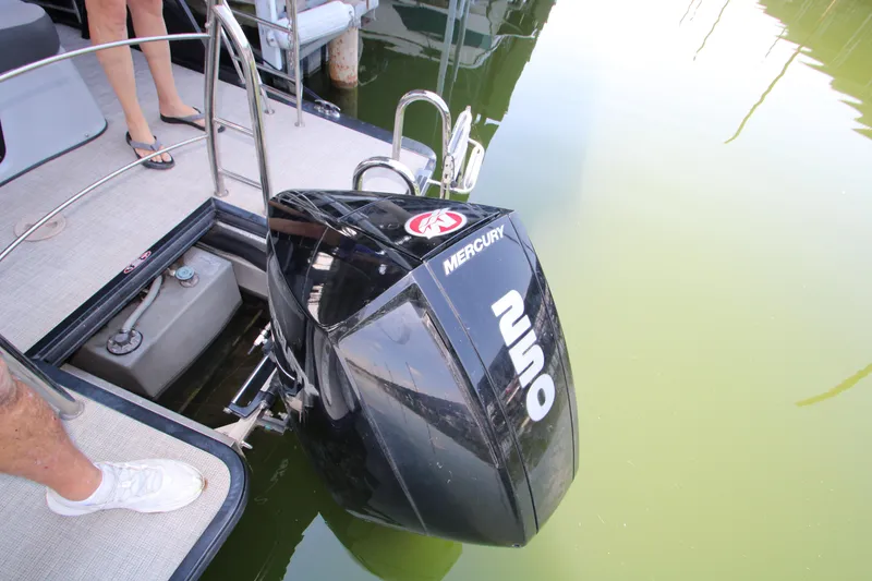 Slide: The Image of 2020 Harris FloteBote Solstice 250 SL with Mercury outboard motor in water. - 28