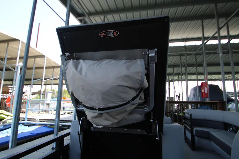 Slide: The Image of 2020 Harris FloteBote Solstice 250 SL boat seat with storage compartment in marina setting. - 33