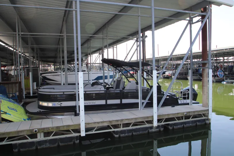 Slide: The Image of 2020 Harris FloteBote Solstice 250 SL pontoon boat docked in marina. - 35
