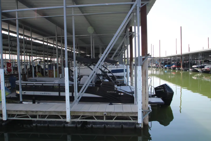 Slide: The Image of 2020 Harris FloteBote Solstice 250 SL pontoon boat docked in a marina. - 36