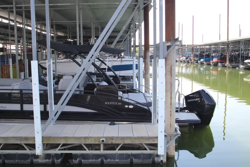 Slide: The Image of 2020 Harris FloteBote Solstice 250 SL pontoon boat docked in marina. - 37
