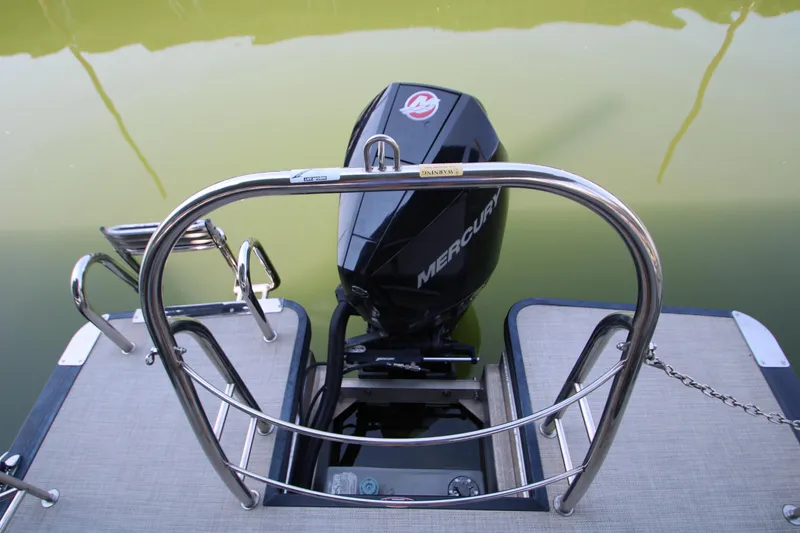 Slide: The Image of 2020 Harris FloteBote Solstice 250 SL with Mercury outboard motor on calm water. - 6