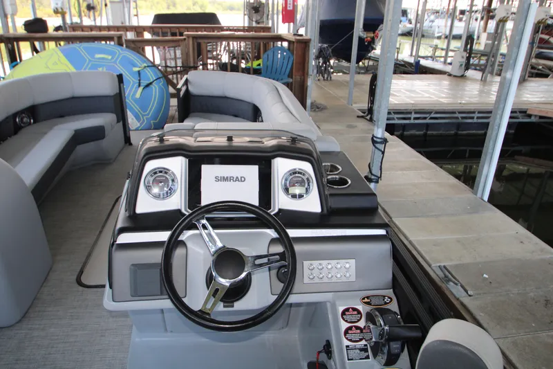 Slide: The Image of 2020 Harris FloteBote Solstice 250 SL pontoon boat interior with steering console. - 9