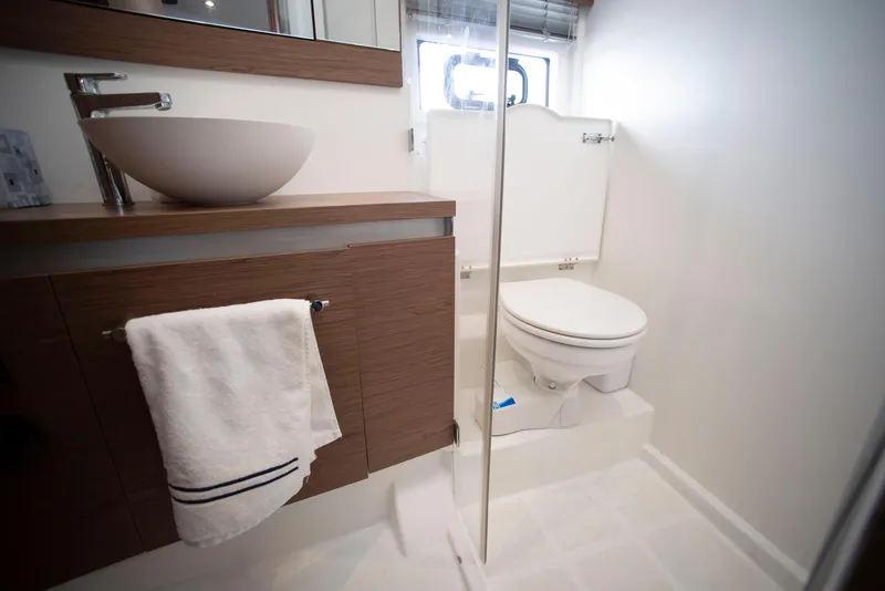 Slide: The Image of Bathroom interior of 2017 Jeanneau Leader 40 yacht, featuring modern sink and toilet. - 40