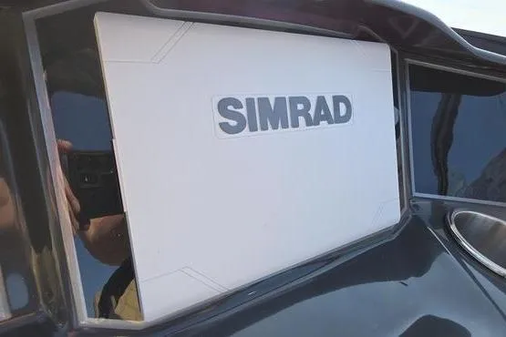 Slide: The Image of Simrad navigation system on 2025 Bayliner VR5 OB boat dashboard. - 11