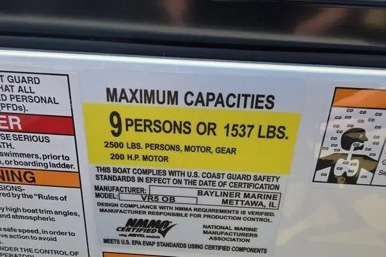 Slide: The Image of Bayliner VR5 OB 2025 capacity label: 9 persons or 1537 lbs, 200 HP motor. - 12