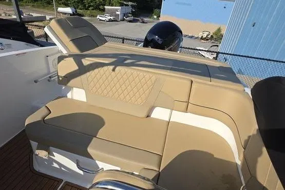 Slide: The Image of 2025 Bayliner VR5 OB boat with tan seating and modern design. - 20