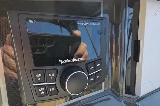 Slide: The Image of Rockford Fosgate audio system on 2025 Bayliner VR5 OB boat dashboard. - 6