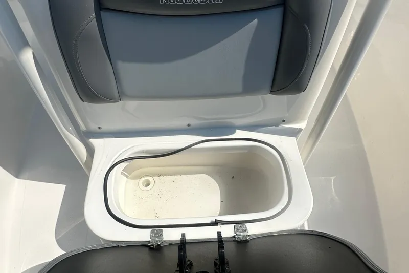 Slide: The Image of 2023 NauticStar 2102 Legacy boat seat with storage compartment open. - 16