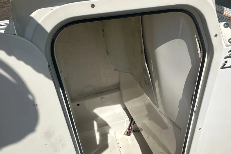 Slide: The Image of 2023 NauticStar 2102 Legacy boat interior storage compartment. - 30