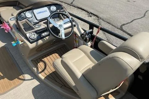 Slide: The Image of 2018 Sun Tracker Regency 220SL boat interior with steering wheel and control panel. - 4