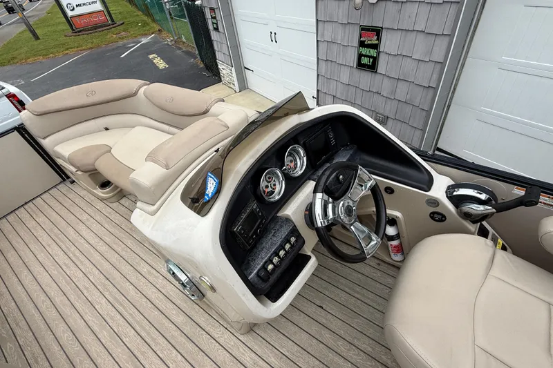 Slide: The Image of 2018 Avalon 2385 Catalina Rear Lounger, Tri Toon boat interior with steering console and seating. - 16