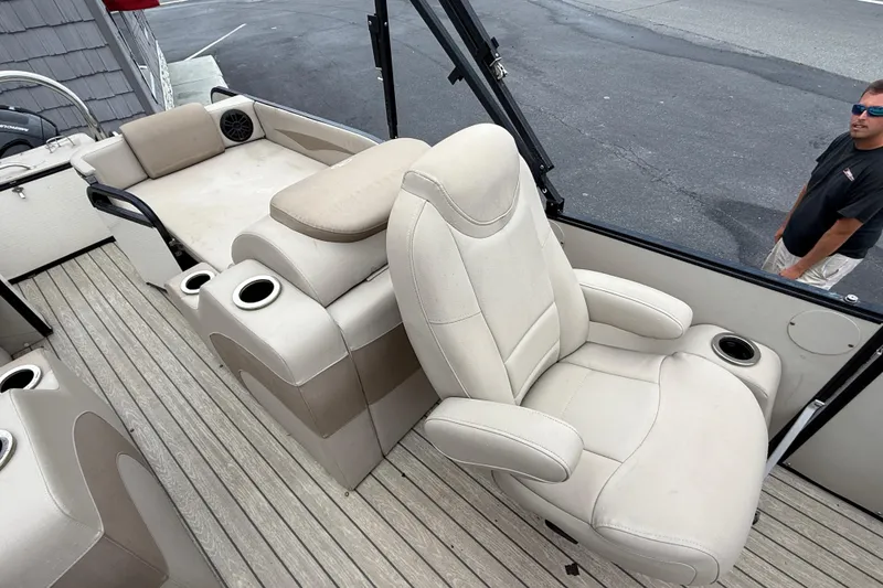 Slide: The Image of 2018 Avalon 2385 Catalina Rear Lounger with plush seating and cup holders on deck. - 22