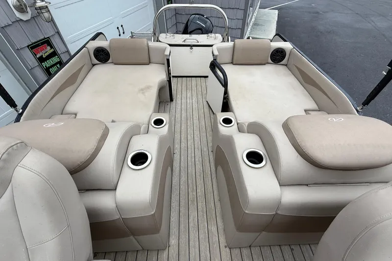 Slide: The Image of 2018 Avalon 2385 Catalina Rear Lounger, Tri Toon, with beige seating and cup holders. - 23
