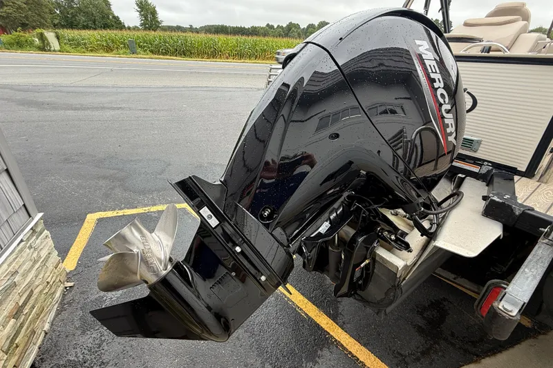 Slide: The Image of 2018 Avalon 2385 Cataloina boat with Mercury outboard motor, parked on asphalt. - 8