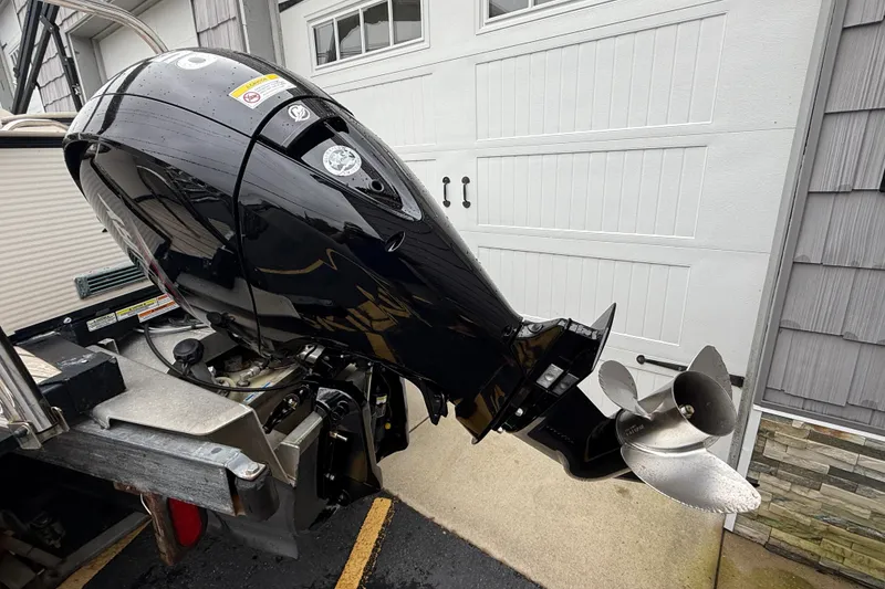 Slide: The Image of 2018 Avalon 2385 Cataloina Rear Lounger boat with high-performance outboard motor. - 9