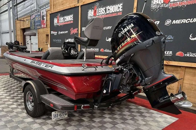 Slide: The Image of 2014 Skeeter ZX 190 bass boat with Yamaha engine in showroom setting. - 5