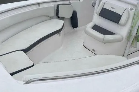 Slide: The Image of 2020 Tidewater 220 CC boat interior with cushioned seating and modern design. - 3