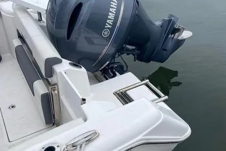 Slide: The Image of 2020 Tidewater 220 CC boat with Yamaha outboard motor on calm water. - 9