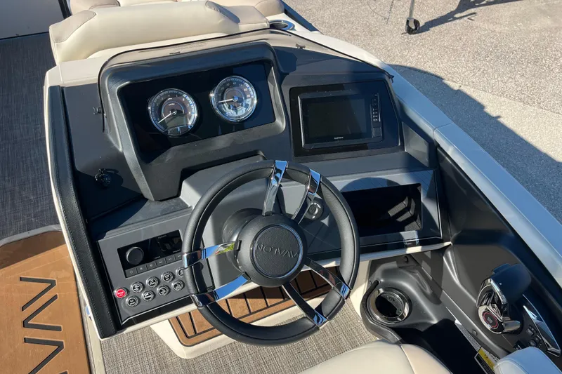 Slide: The Image of Steering console of 2026 Avalon 2385 Catalina Quad Lounger, featuring modern controls and gauges. - 12