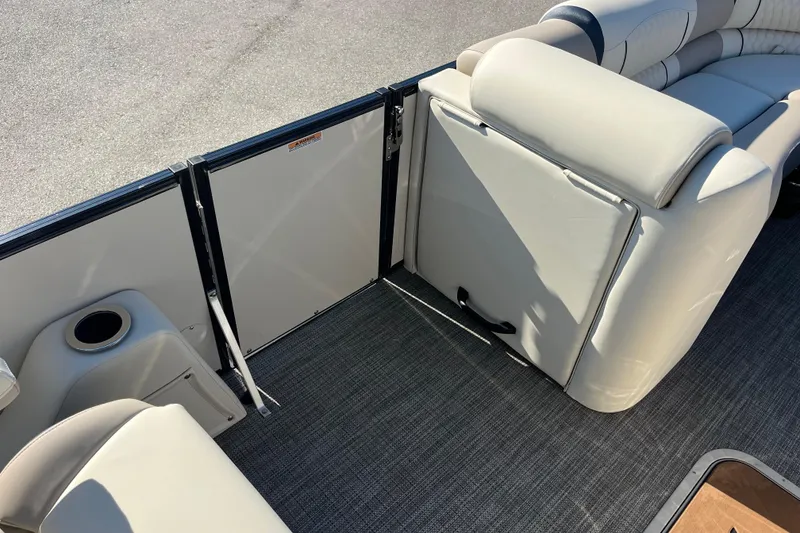 Slide: The Image of 2026 Avalon 2385 Catalina Quad Lounger interior with plush seating and cup holder. - 13