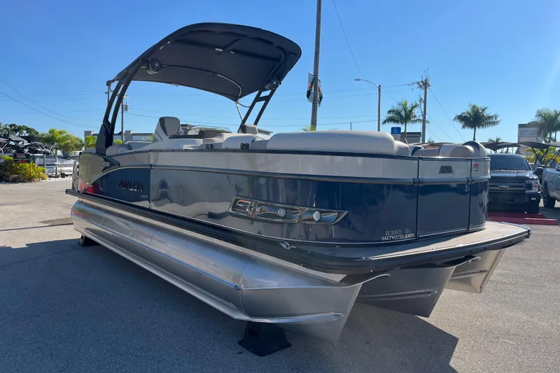 Slide: The Image of 2026 Avalon 2385 Catalina Quad Lounger Tri Toon boat in a sunny outdoor setting. - 3