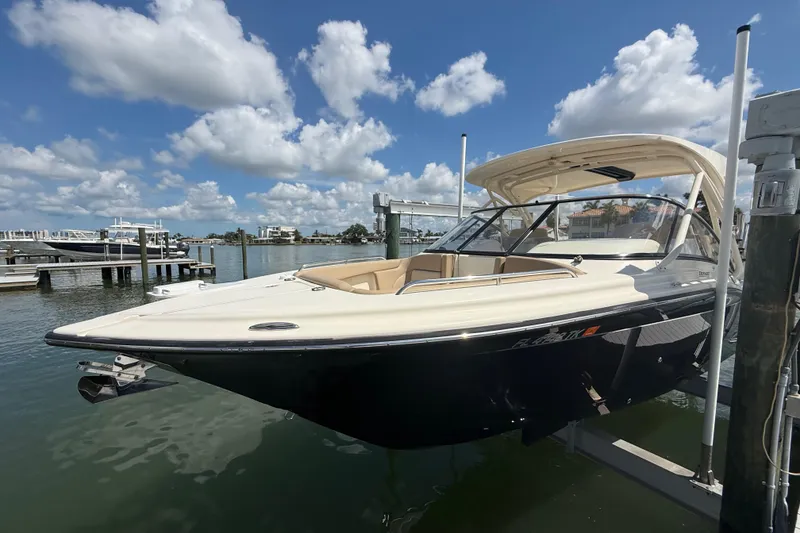 The Image of 2023 Scout 255 Dorado boat docked under a clear blue sky. - 0