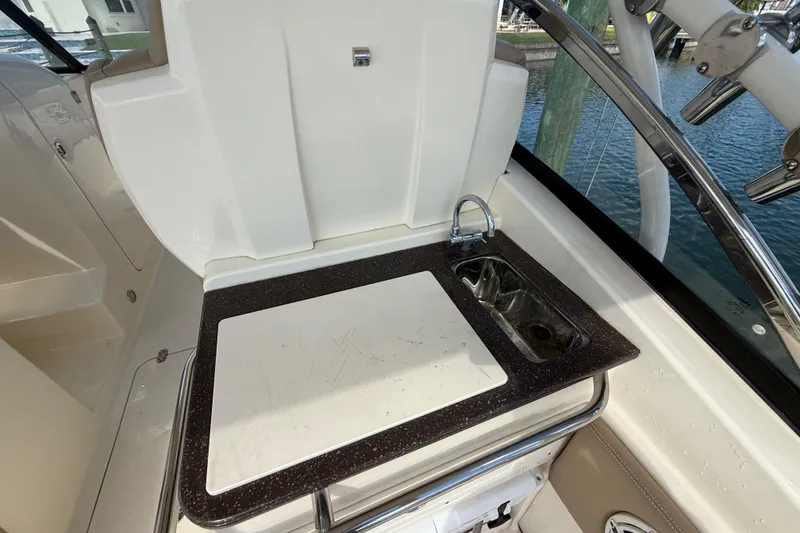 Slide: The Image of 2023 Scout 255 Dorado boat interior with sink and countertop. - 16