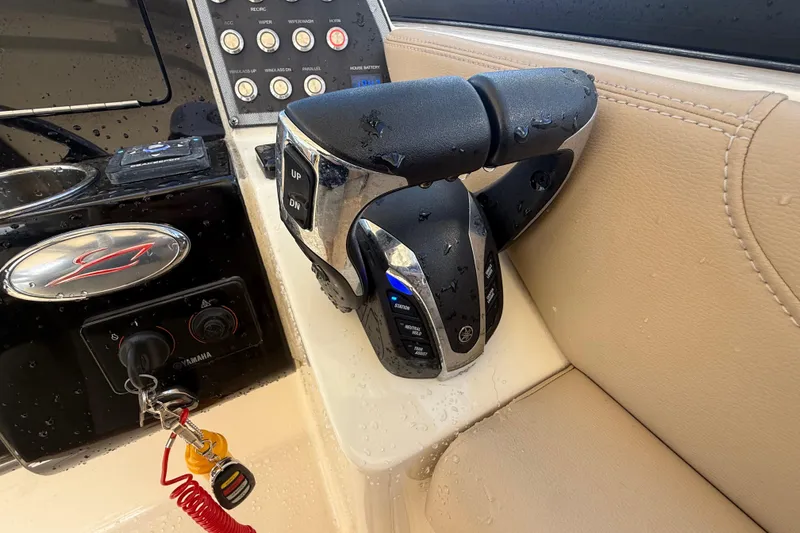Slide: The Image of 2023 Scout 255 Dorado boat controls with Yamaha throttle and key ignition. - 31