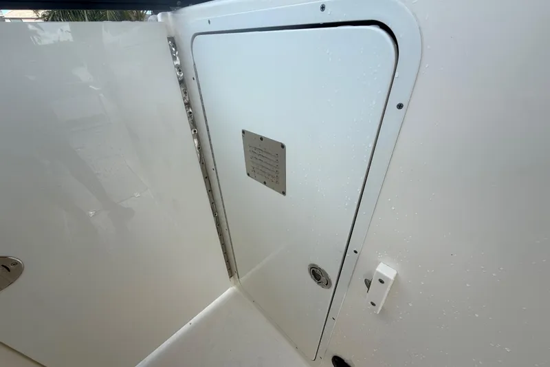 Slide: The Image of 2023 Scout 255 Dorado boat interior with white compartment door. - 37