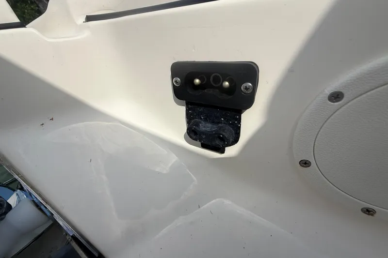 Slide: The Image of 2023 Scout 255 Dorado boat detail showing a mounted electrical outlet. - 60