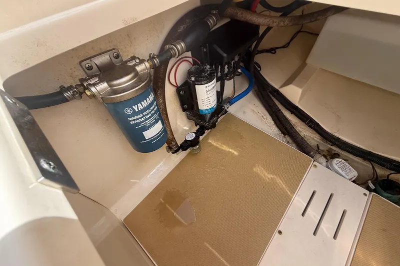 Slide: The Image of 2023 Scout 255 Dorado boat engine compartment with Yamaha marine fuel filter. - 75