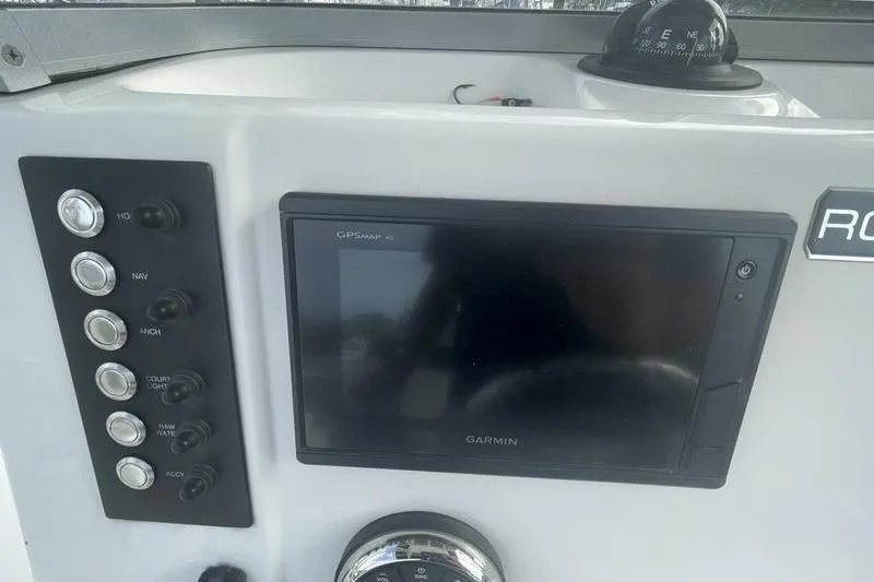 Slide: The Image of 2020 Robalo R200 boat dashboard with Garmin GPS and control panel. - 7