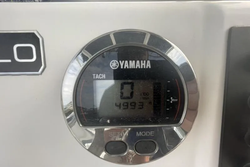 Slide: The Image of Yamaha tachometer on 2020 Robalo R200 boat displaying 4993 RPM. - 8