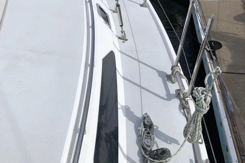 Slide: The Image of Deck view of a 1996 Catalina 36 MkII sailboat, featuring rigging and railing. - 11