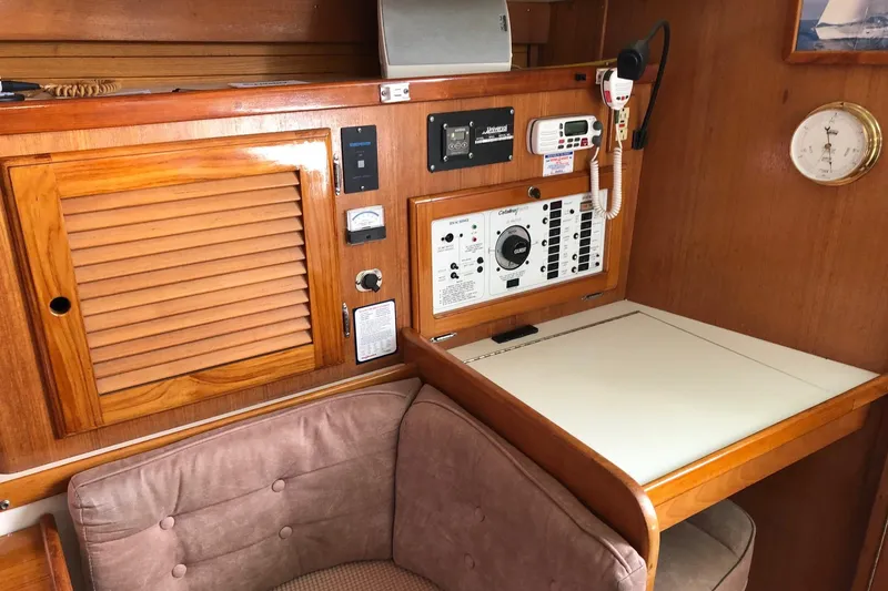 Slide: The Image of Interior of a 1996 Catalina 36 MkII sailboat with navigation equipment and wooden cabinetry. - 3