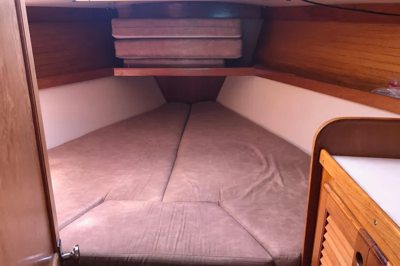 Slide: The Image of Interior cabin of a 1996 Catalina 36 MkII sailboat with cozy bedding. - 4