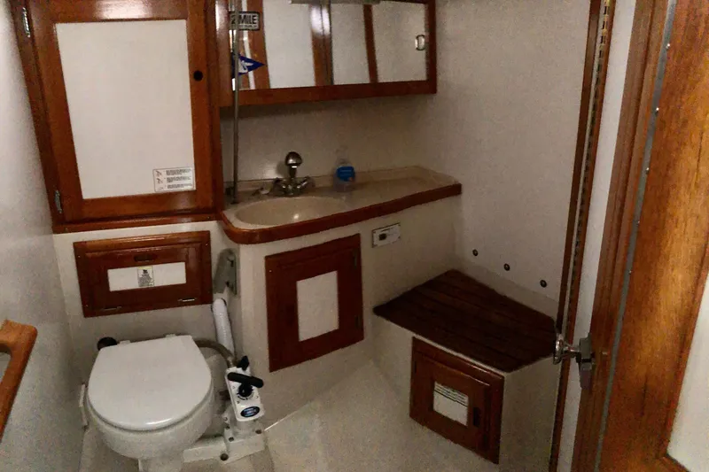 Slide: The Image of Bathroom interior of 1996 Catalina 36 MkII yacht with wooden accents and fixtures. - 5