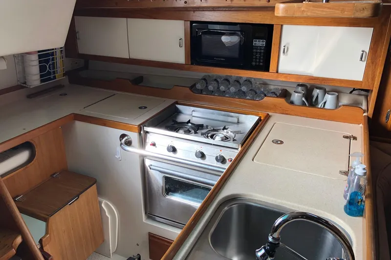 Slide: The Image of Galley kitchen in 1996 Catalina 36 MkII sailboat with stove, microwave, and sink. - 7