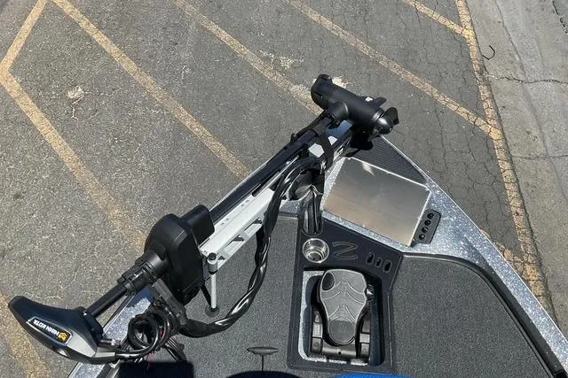 Slide: The Image of 2026 Ranger Z518 boat deck with trolling motor and control panel. - 11