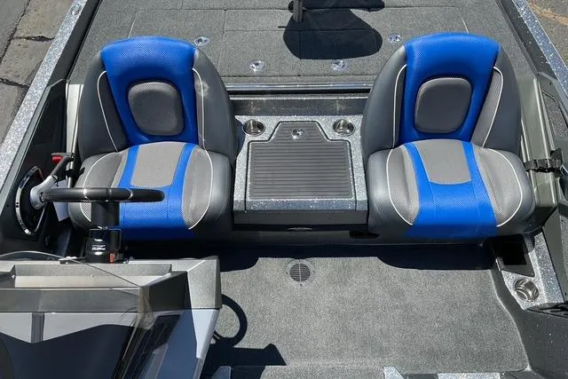 Slide: The Image of 2026 Ranger Z518 boat interior with blue and gray seats, steering wheel, and console. - 9
