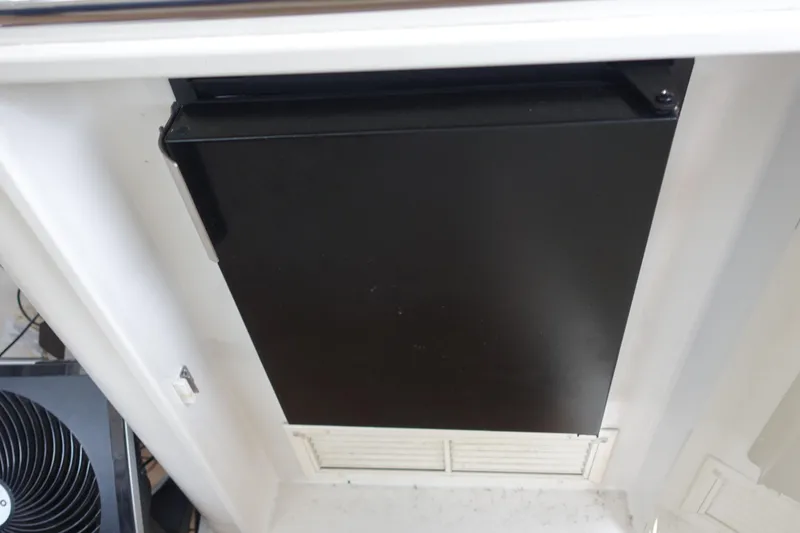 Slide: The Image of Black refrigerator in 2007 Chris-Craft Roamer 40 yacht interior. - 10