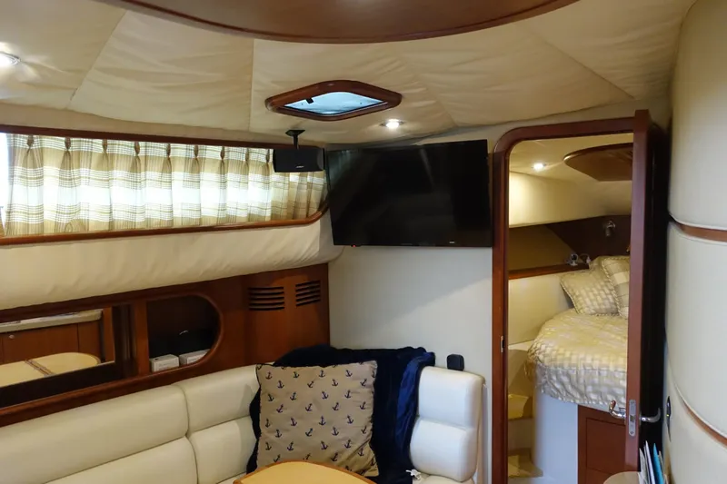 Slide: The Image of Luxurious interior of 2007 Chris-Craft Roamer 40 yacht with cozy seating and bedroom. - 12