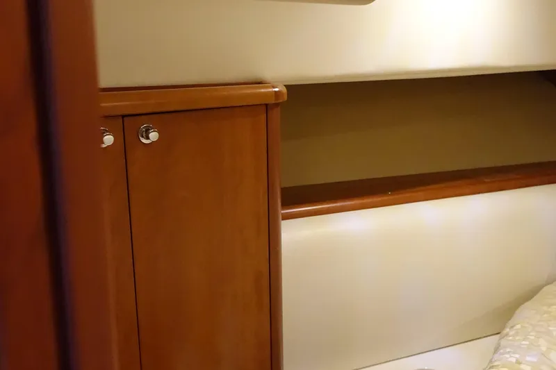 Slide: The Image of Interior of 2007 Chris-Craft Roamer 40 yacht with wooden cabinetry and beige upholstery. - 20