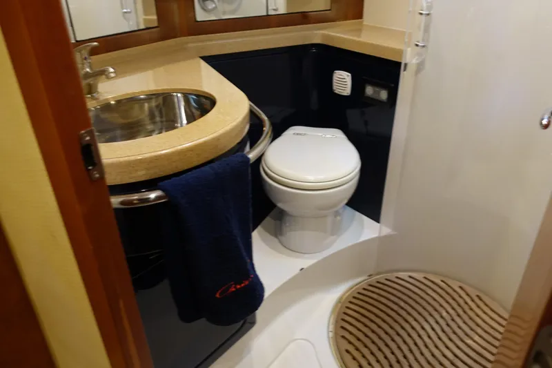 Slide: The Image of Luxurious bathroom in 2007 Chris-Craft Roamer 40 yacht with modern fixtures and elegant design. - 21