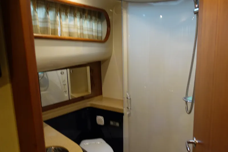 Slide: The Image of Interior of 2007 Chris-Craft Roamer 40 yacht bathroom with shower and storage. - 22