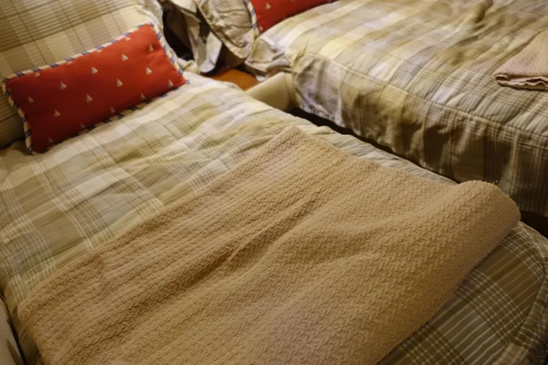 Slide: The Image of Cozy twin beds with plaid bedding on 2007 Chris-Craft Roamer 40 yacht. - 25